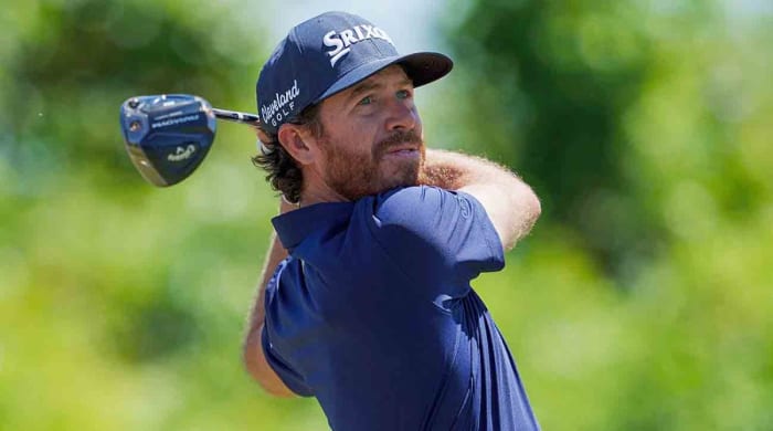 Sam Ryder watches a drive in 2022 on the PGA Tour.